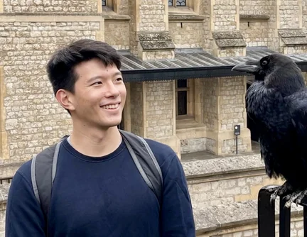 Zachary Wu with a raven